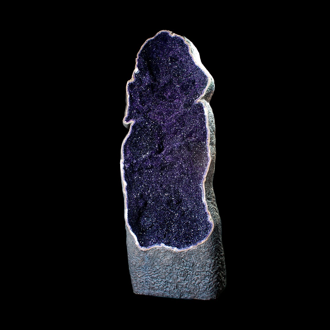 A giant open amethyst geode, standing upright